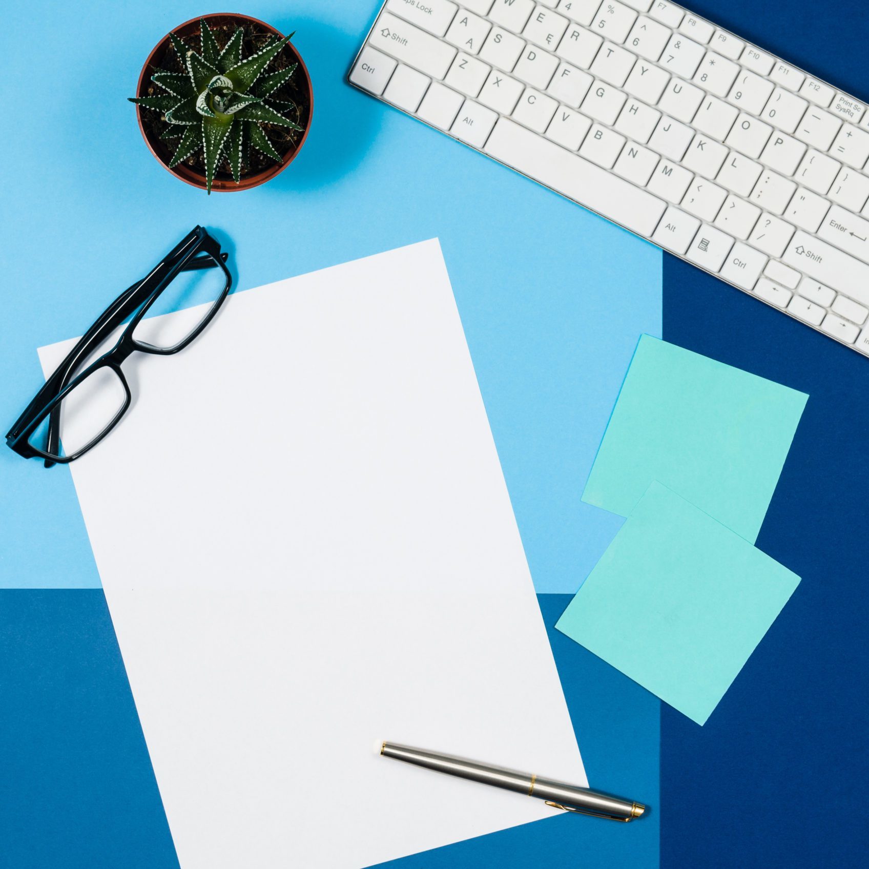 Mock-up magazine or catalog on colorful table. White page or notepad on modern background. Blank copy space for mockups or simulations.