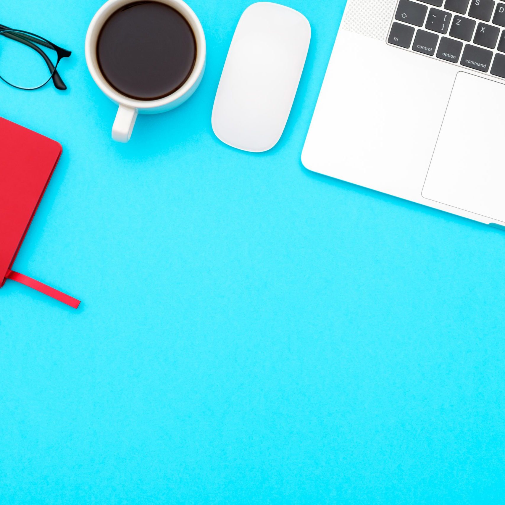 Office desk table with laptop, and supplies. Top view with copy space. Flat lay
